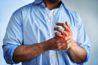 man holding hand in pain